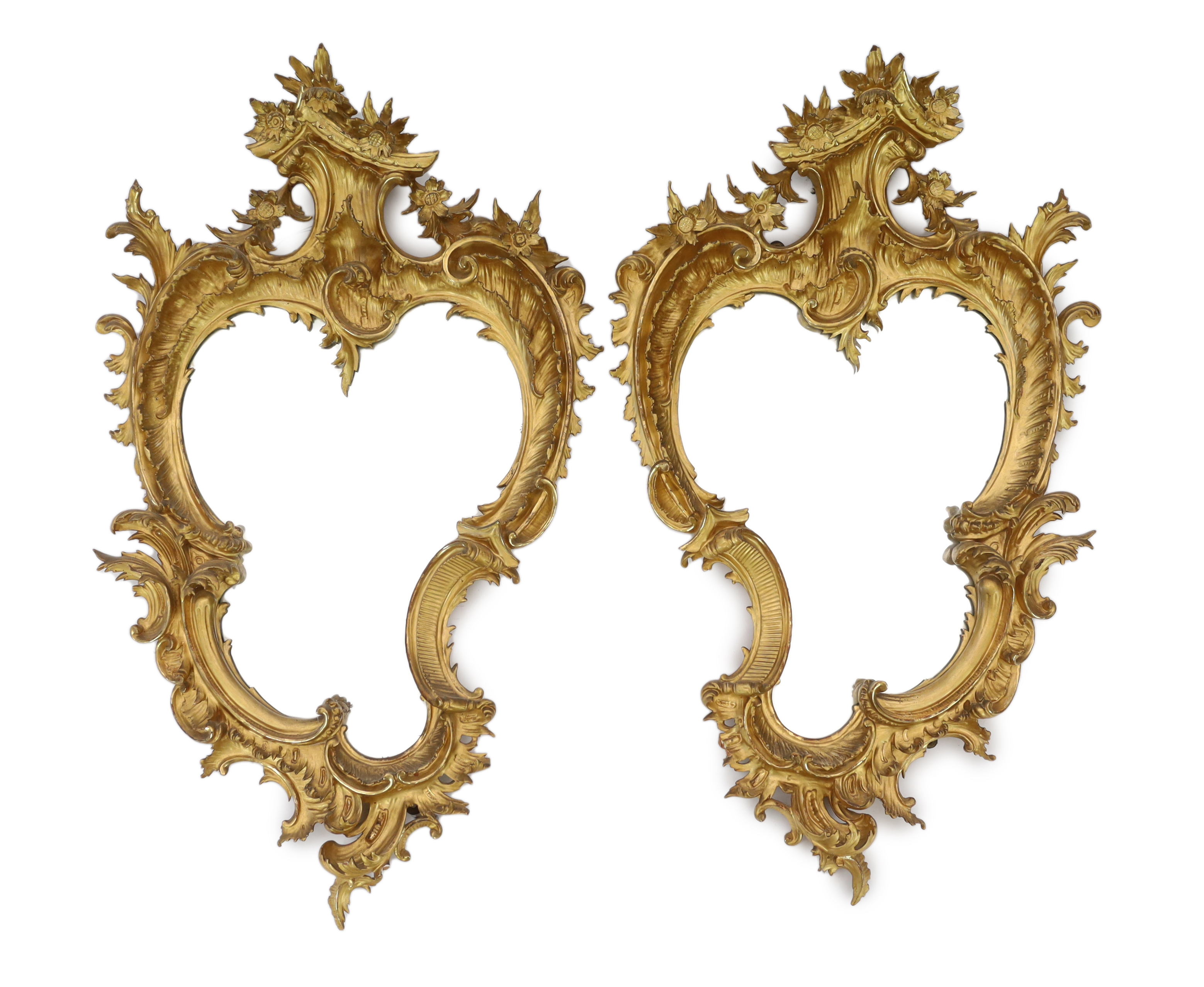 A pair of 19th century carved giltwood wall mirrors in the Rococo style, width 57cm, height 96cm